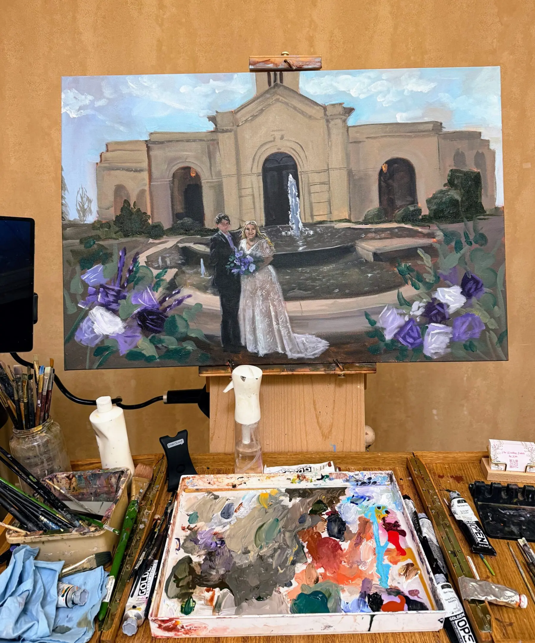 A painting of two people in front of an old church.