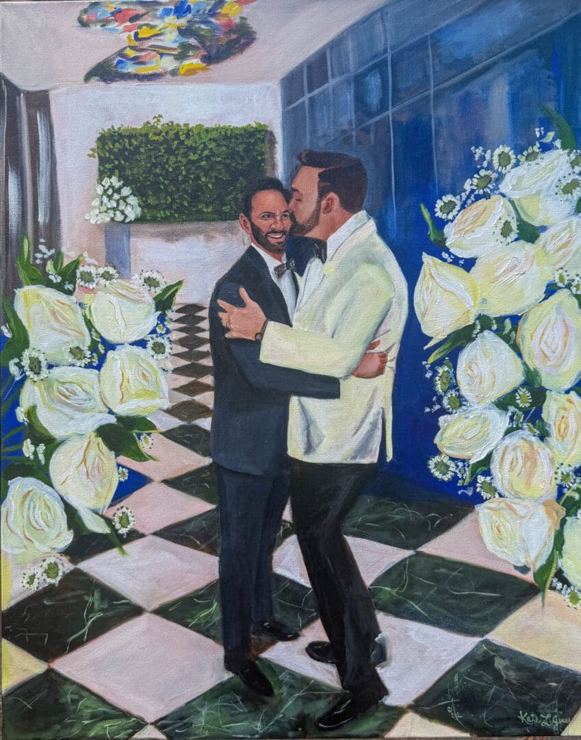 Live wedding painting of two grooms in tuxedos dancing and sharing a kiss on a black and white checkered floor framed by white rose floral arrangements.