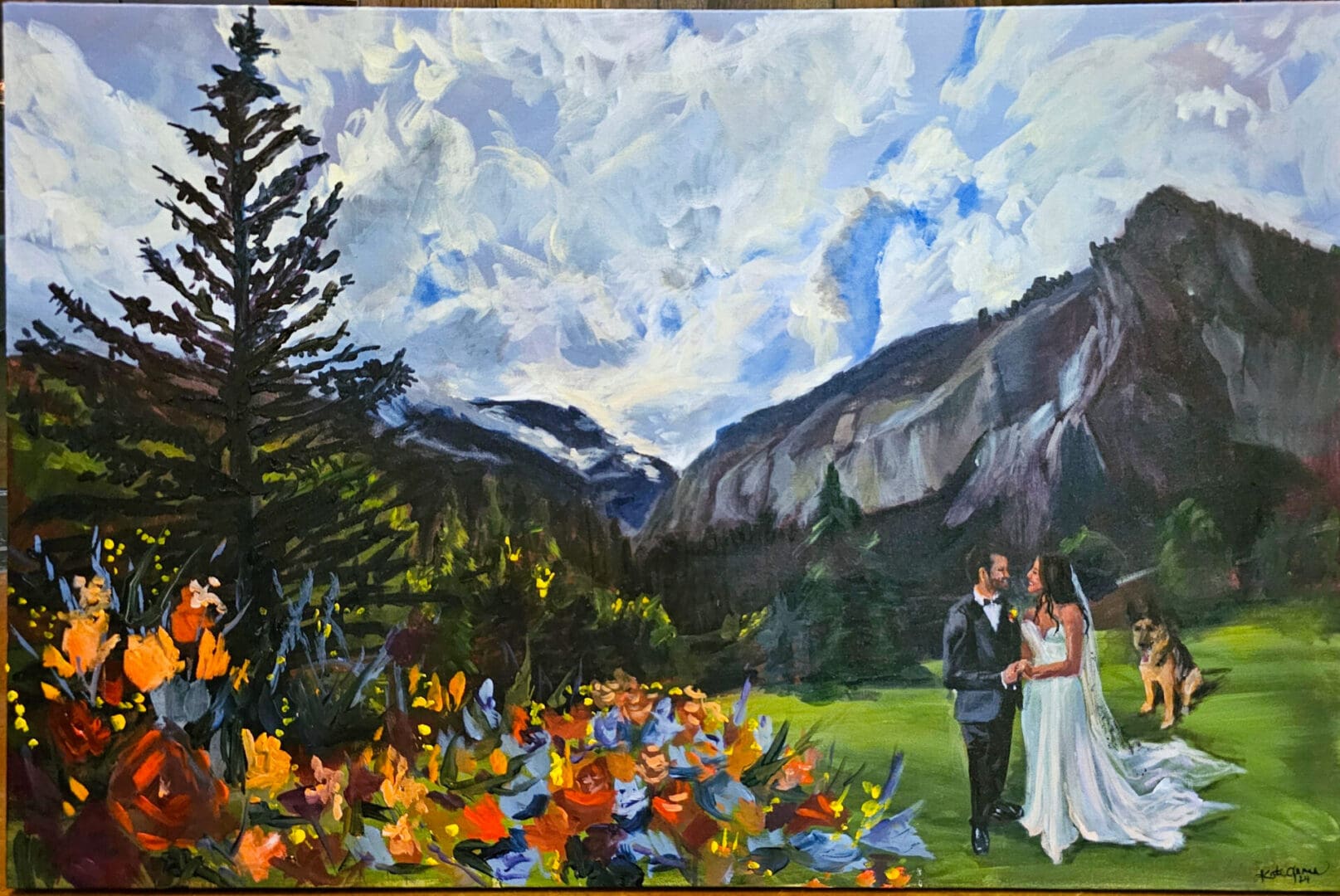 Live wedding painting of a bride in a white gown and groom in a black suit standing hand-in-hand in a mountain valley beneath dramatic clouds and rocky cliffs.